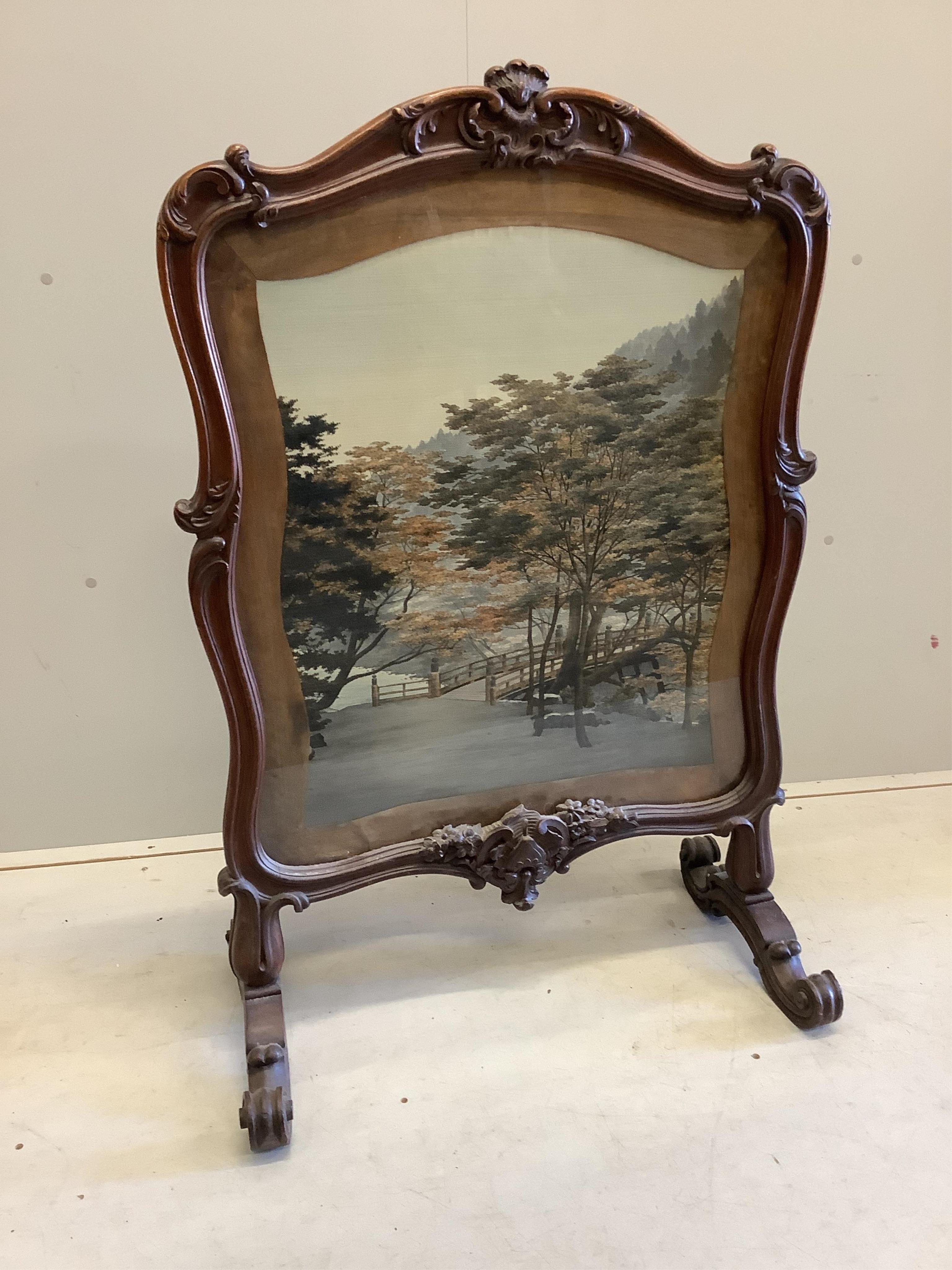 A Victorian rosewood firescreen, inset machined panel, width 75cm, depth 39cm, height 111cm